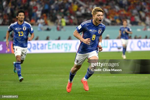 Ritsu Doan of Japan celebrates after scoring the team's first goal during the FIFA World Cup Qatar 2022 Group E match between Japan and Spain at...