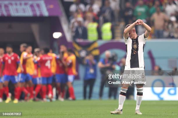 Joshua Kimmich of Germany reacts after conceding a goal to Yeltsin Tejeda of Costa Rica during the FIFA World Cup Qatar 2022 Group E match between...