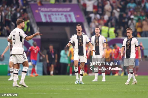 Germany players react after conceding their first goal to Yeltsin Tejeda of Costa Rica during the FIFA World Cup Qatar 2022 Group E match between...