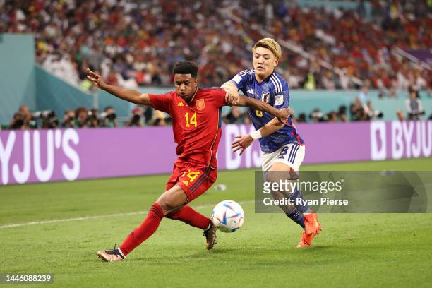 Alejandro Balde of Spain controls the ball against Ritsu Doan of Japan during the FIFA World Cup Qatar 2022 Group E match between Japan and Spain at...