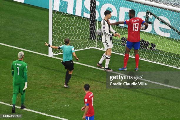 Kendall Waston of Costa Rica clashes with Kai Havertz of Germany after the latter scored their sides second goal during the FIFA World Cup Qatar 2022...