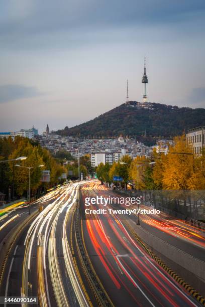 n seoul tower view and city traffic at dusk in seoul city south korea - day n night stock pictures, royalty-free photos & images