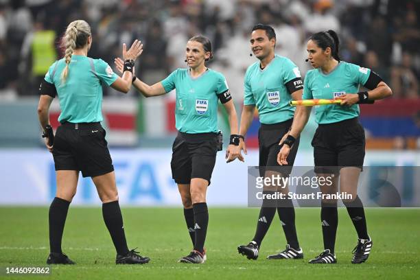 Referee Stephanie Frappart embraces assistants Neuza Back and Karen Diaz Medina after the FIFA World Cup Qatar 2022 Group E match between Costa Rica...