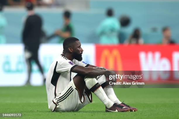 Antonio Ruediger of Germany looks dejected after their sides' elimination from the tournament during the FIFA World Cup Qatar 2022 Group E match...