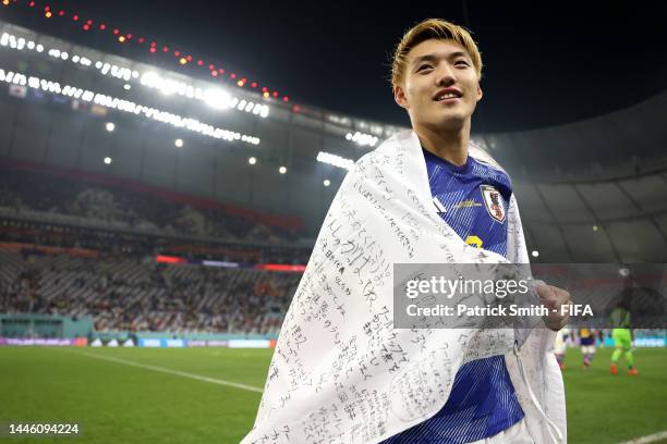 Ritsu Doan of Japan celebrates their 2-1 victory and qualification for the knockout stage after during the FIFA World Cup Qatar 2022 Group E match...