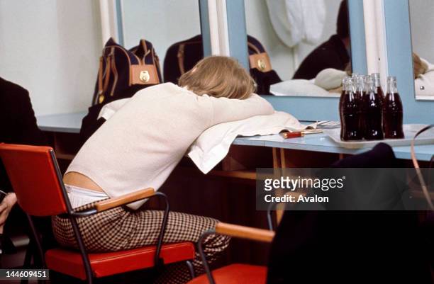 Brian Jones of The Rolling Stones taking a break backstage in the mid to late 1960s.