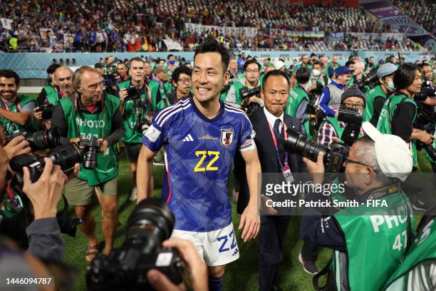 Maya Yoshida of Japan celebrates their 2-1 victory and qualification for the knockout stage after the FIFA World Cup Qatar 2022 Group E match between...