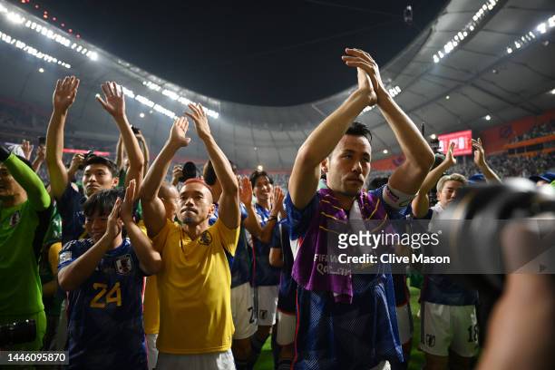 Maya Yoshida and Japan players applaud fans after their 2-1 victory and qualification for the knockout stage after the FIFA World Cup Qatar 2022...