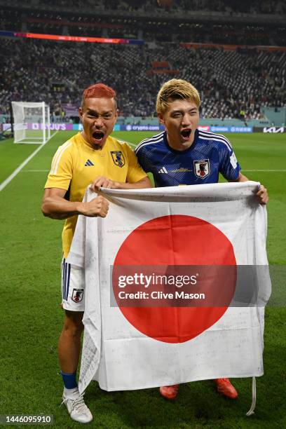 Ritsu Doan and Yuto Nagatomo of Japan pose for photographers after their 2-1 victory and qualification for the knockout stage following the FIFA...