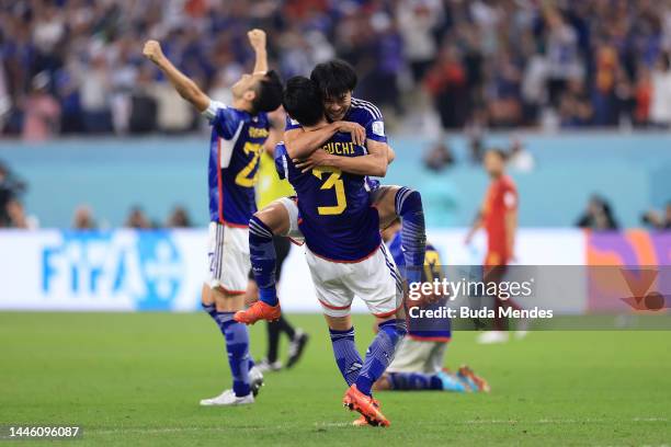 Japan players celebrate after the team's qualification to the knockout stages during the FIFA World Cup Qatar 2022 Group E match between Japan and...