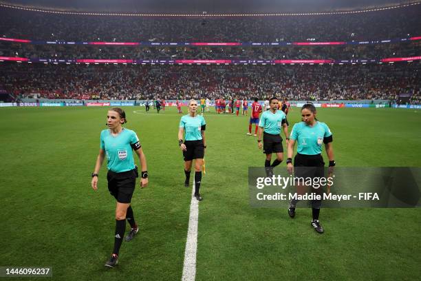 Referees Stephanie Frappart, Neuza Ines Back and Karen Diaz Medina walk off the pitch after the FIFA World Cup Qatar 2022 Group E match between Costa...