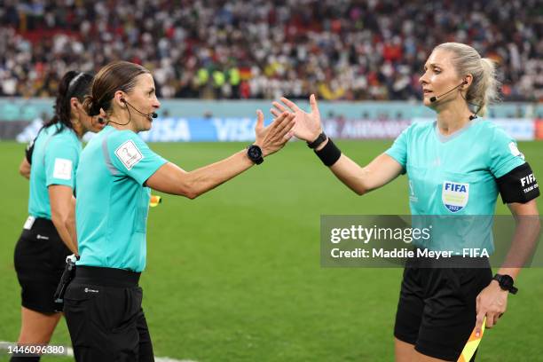 Referees Stephanie Frappart and Neuza Ines Back shake hands after the FIFA World Cup Qatar 2022 Group E match between Costa Rica and Germany at Al...