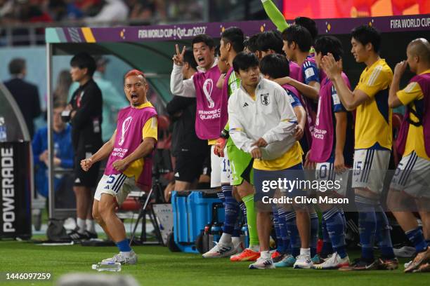 Yuto Nagatomo and Japan players celebrate their 2-1 victory and qualification for the knockout stage after during the FIFA World Cup Qatar 2022 Group...