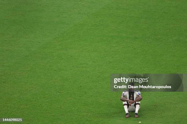 Antonio Ruediger of Germany looks dejected after their sides' elimination from the tournament during the FIFA World Cup Qatar 2022 Group E match...