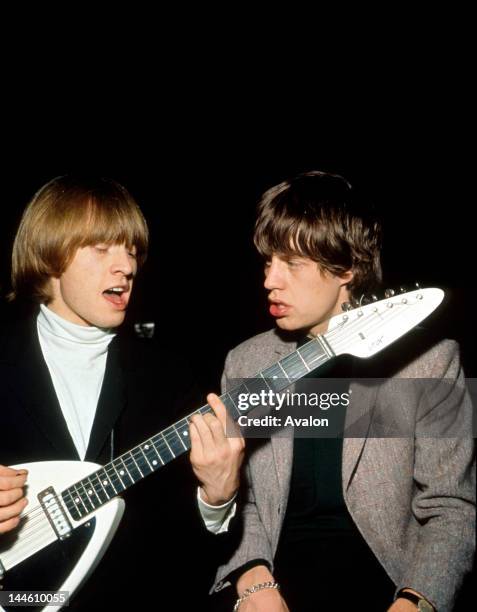 Portrait of Rolling Stones guitarist Brian Jones and singer Mick Jagger photographed in 1966.;