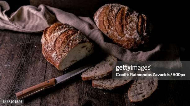 close-up of bread on table,london,united kingdom,uk - bread knife stock-fotos und bilder