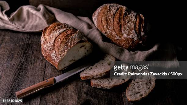 close-up of bread on table,london,united kingdom,uk - bread knife stock pictures, royalty-free photos & images