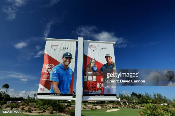 Posters showing Tiger Woods and Viktor Hovland beside the short-game area during the first round of the 2022 Hero World Challenge at Albany Golf...