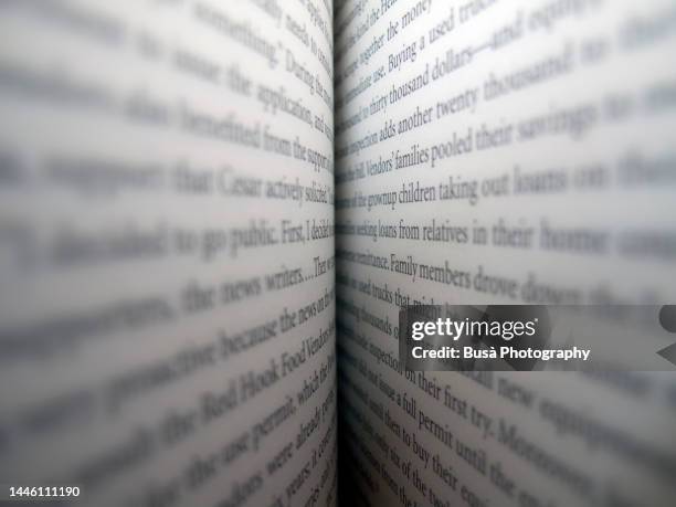 close-up of an open book - palavra única imagens e fotografias de stock