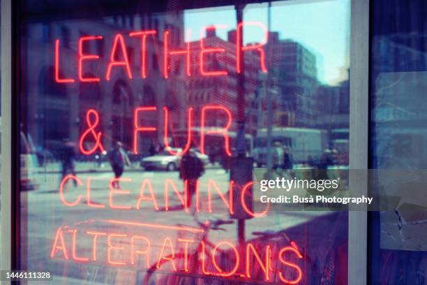 dry cleaners and laundromat neon sign in manhattan, new york city - the tailor nyc stock pictures, royalty-free photos & images