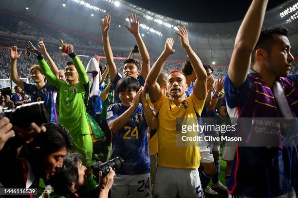 Japan players applaud fans after their 2-1 victory and qualification for the knockout stage during the FIFA World Cup Qatar 2022 Group E match...