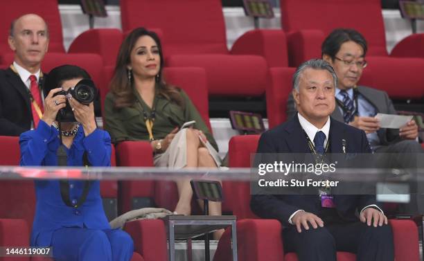 Japan's Princess Hisako of Takamado takes pictures with a camera and Japan Football Association President Kozo Tashima looks on during the FIFA World...