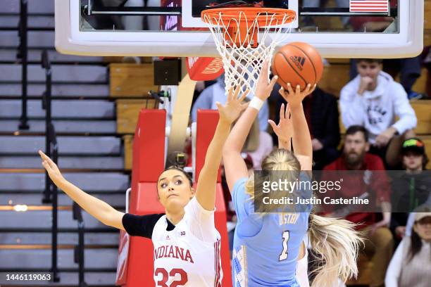 Alyssa Ustby of the North Carolina Tar Heels takes a shot over Alyssa Geary of the Indiana Hoosiers during the first half at Simon Skjodt Assembly...