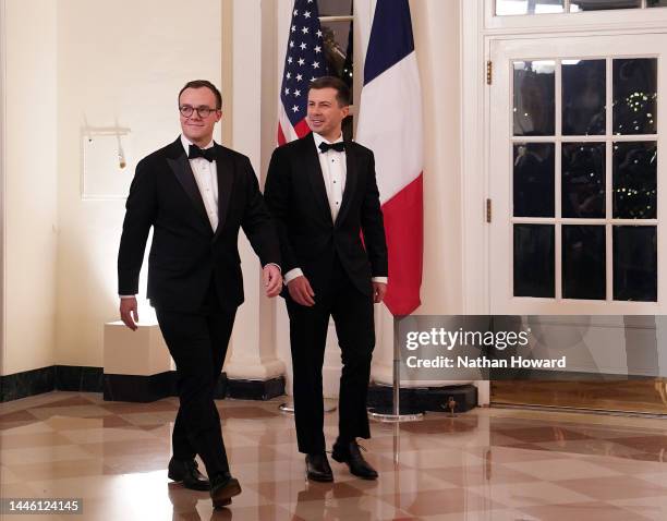 Transportation Secretary Pete Buttigieg and his husband Chasten Buttigieg arrive for the White House state dinner for French President Emmanuel...