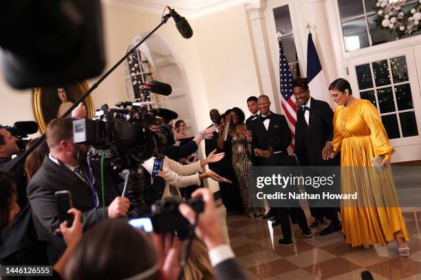 Musician Jon Batiste and family arrive for the White House state dinner for French President Emmanuel Macron at the White House on December 1, 2022...