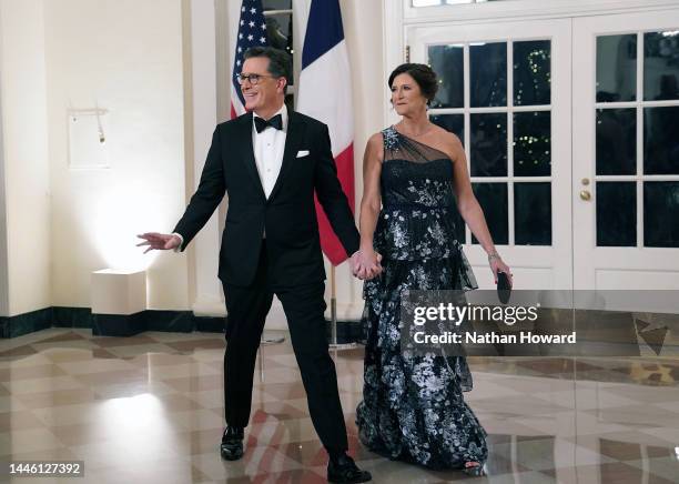 Comedian Stephen Colbert and his wife Evelyn McGee-Colbert arrive for the White House state dinner for French President Emmanuel Macron at the White...