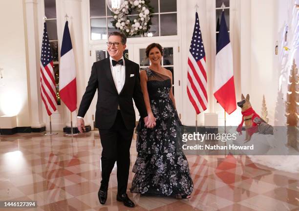 Comedian Stephen Colbert and his wife Evelyn McGee-Colbert arrive for the White House state dinner for French President Emmanuel Macron at the White...