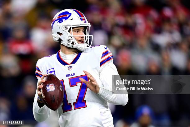 Quarterback Josh Allen of the Buffalo Bills drops back to pass in the first quarter against the New England Patriots at Gillette Stadium on December...