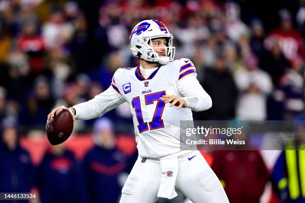 Quarterback Josh Allen of the Buffalo Bills drops back to pass in the first quarter against the New England Patriots at Gillette Stadium on December...