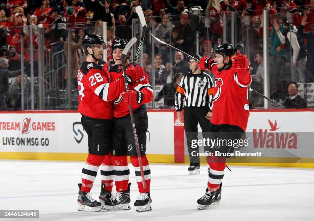 Alexander Holtz of the New Jersey Devils celebrates his powerplay goal at 4:35 of the first period against the Nashville Predators and is joined by...