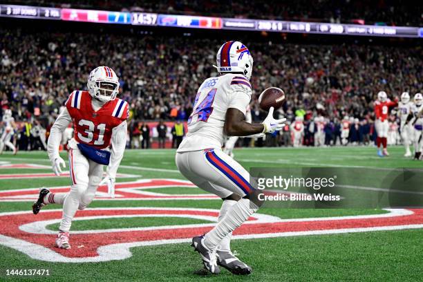 Wide receiver Stefon Diggs of the Buffalo Bills catches a first half touchdown pass in front of cornerback Jonathan Jones of the New England Patriots...