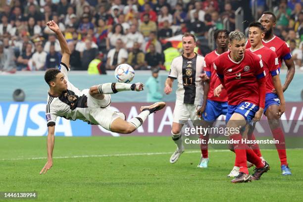 Jamal Musiala of Germany battles for the ball during the FIFA World Cup Qatar 2022 Group E match between Costa Rica and Germany at Al Bayt Stadium on...