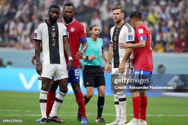 Referee Stephanie Frappart speaks to Oscar Duarte of Costa Rica during the FIFA World Cup Qatar 2022 Group E match between Costa Rica and Germany at...
