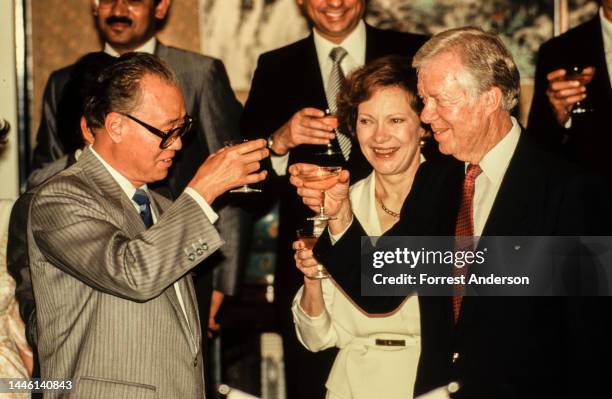 Chinese Premier Zhao Ziyang shares a toast with married couple, former US First Lady Rosalyn Carter and former US President Jimmy Carter, Beijing,...