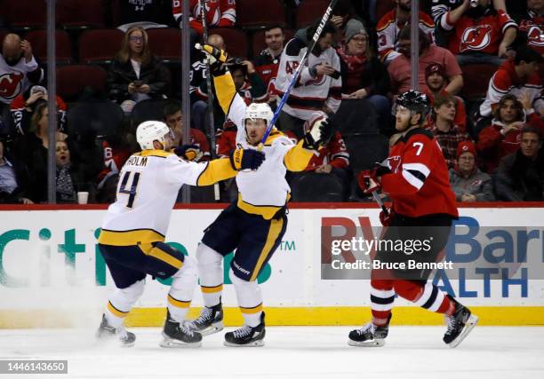 Ryan Johansen of the Nashville Predators scores at 33 seconds of overtime to defeat the New Jersey Devils 4-3 at the Prudential Center on December...