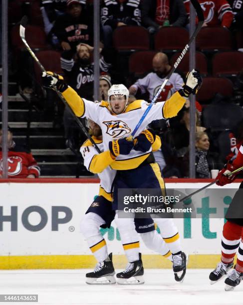 Ryan Johansen of the Nashville Predators scores at 33 seconds of overtime to defeat the New Jersey Devils 4-3 at the Prudential Center on December...