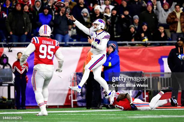 Quarterback Josh Allen of the Buffalo Bills throws a second quarter touchdown pass in front of linebacker Mack Wilson Sr. #30 of the New England...