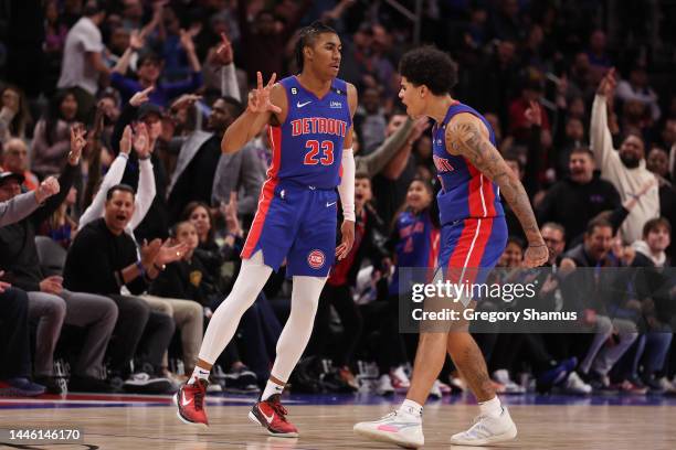 Jaden Ivey of the Detroit Pistons celebrates his second half three pointer with Killian Hayes while playing the Dallas Mavericks at Little Caesars...