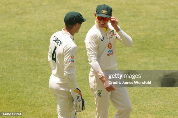 Alex Carey of Australia and Marnus Labuschagne of Australia share a laugh during a break in play during day three of the First Test match between...