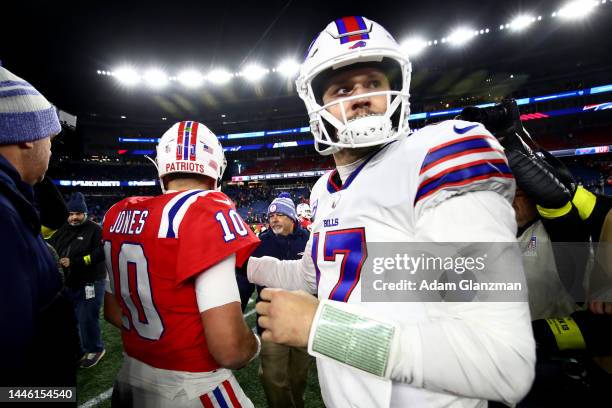Quarterbacks Mac Jones of the New England Patriots and Josh Allen of the Buffalo Bills shake hands following the Bills win at Gillette Stadium on...