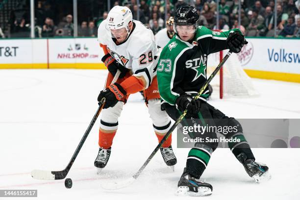 Dmitry Kulikov of the Anaheim Ducks and Wyatt Johnston of the Dallas Stars battle for the puck during the third period at American Airlines Center on...