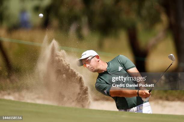 Lucas Herbert of Australia plays a shot out of a bunker during Day 2 of the 2022 ISPS HANDA Australian Open at Victoria Golf Club on December 02,...