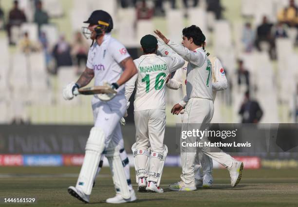 Naseem Shah of Pakistan is congratulated on bowling Ben Stokes of England during the First Test Match between Pakistan and England at Rawalpindi...