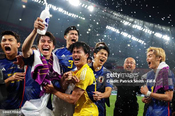 Japan players celebrate their, 2-1, victory and qualification for the knockout stage after the FIFA World Cup Qatar 2022 Group E match between Japan...
