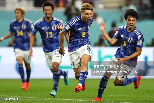 Ritsu Doan of Japan celebrates after scoring the team's first goal during the FIFA World Cup Qatar 2022 Group E match between Japan and Spain at...