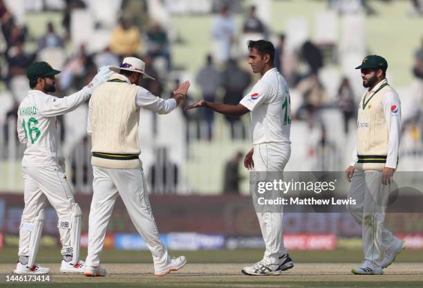 Mohammad Ali of Pakistan is congratulated on the wicket of Will Jacks of England during the First Test Match between Pakistan and England at...